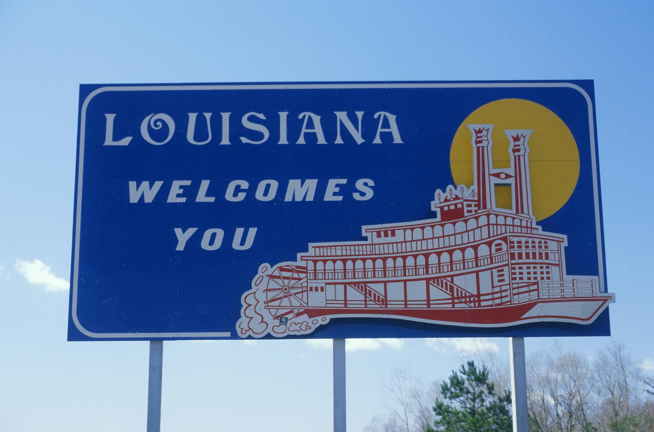 A Welcome to Louisiana sign along the highway.