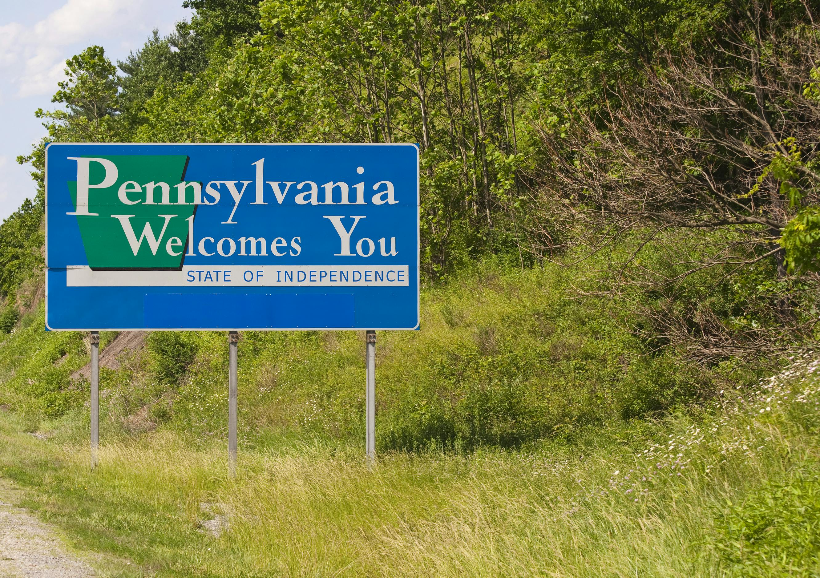 A Welcome to Pennsylvania side along the roadway