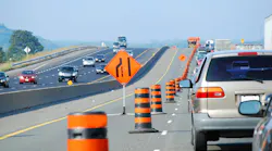 Traffic along an active work zone on a highway.