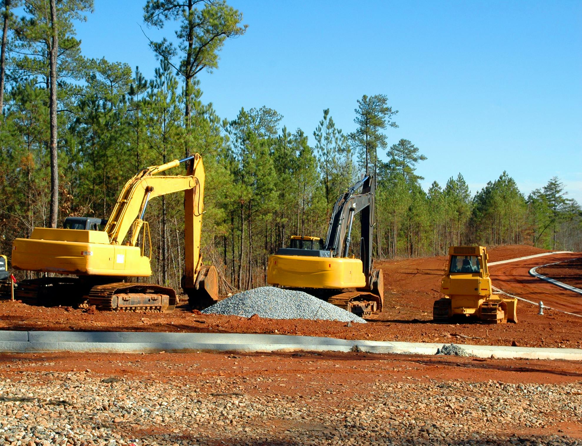 Heavy equipment on a road construction job site.