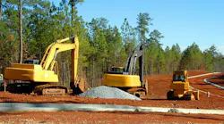 Heavy equipment on a road construction job site.
