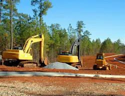 Heavy equipment on a road construction job site.