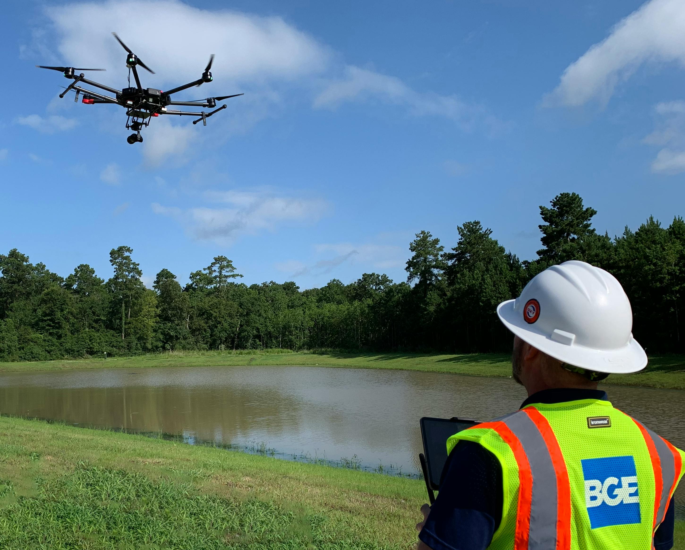 A crew member using a drone for surveying and mapping purposes.